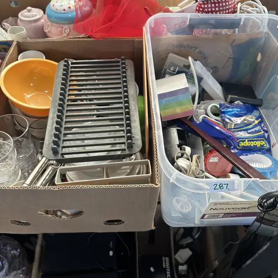 Two boxes stationary, plates bowls and cutlery.