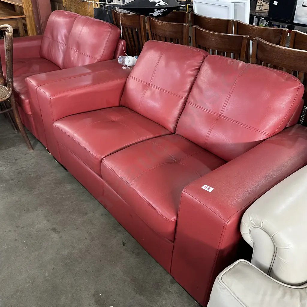 Pair red leather two seaters Image 1++