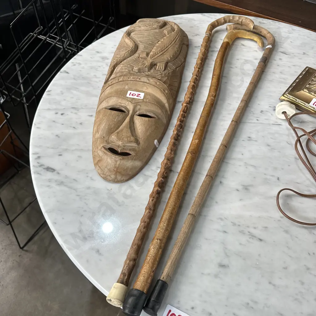 Carved mask and three walking sticks Image 1++