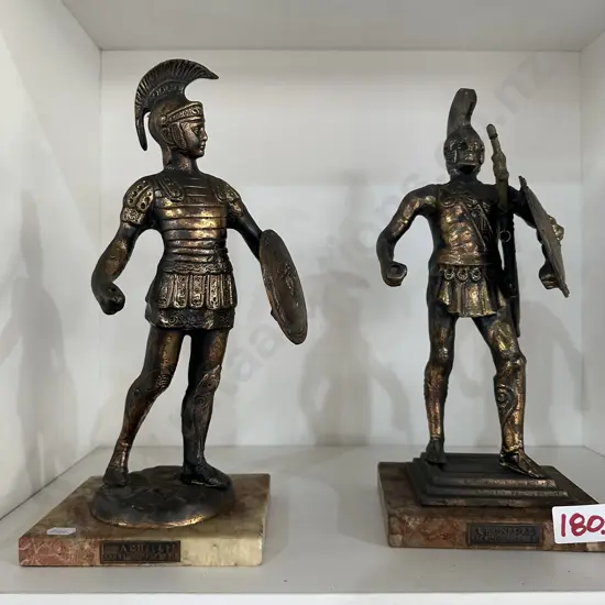 Pr of Bronze figures  (missing daggers) made in Greece