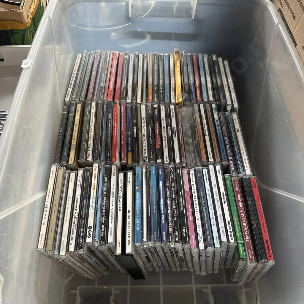 Lidded bin full of CDs Image 1++