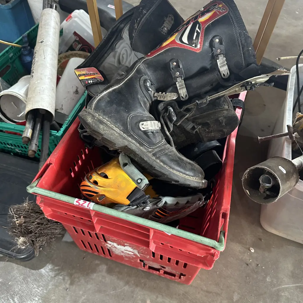 Bin of gumboots, motorbike boots, flippers etc. Image 1++