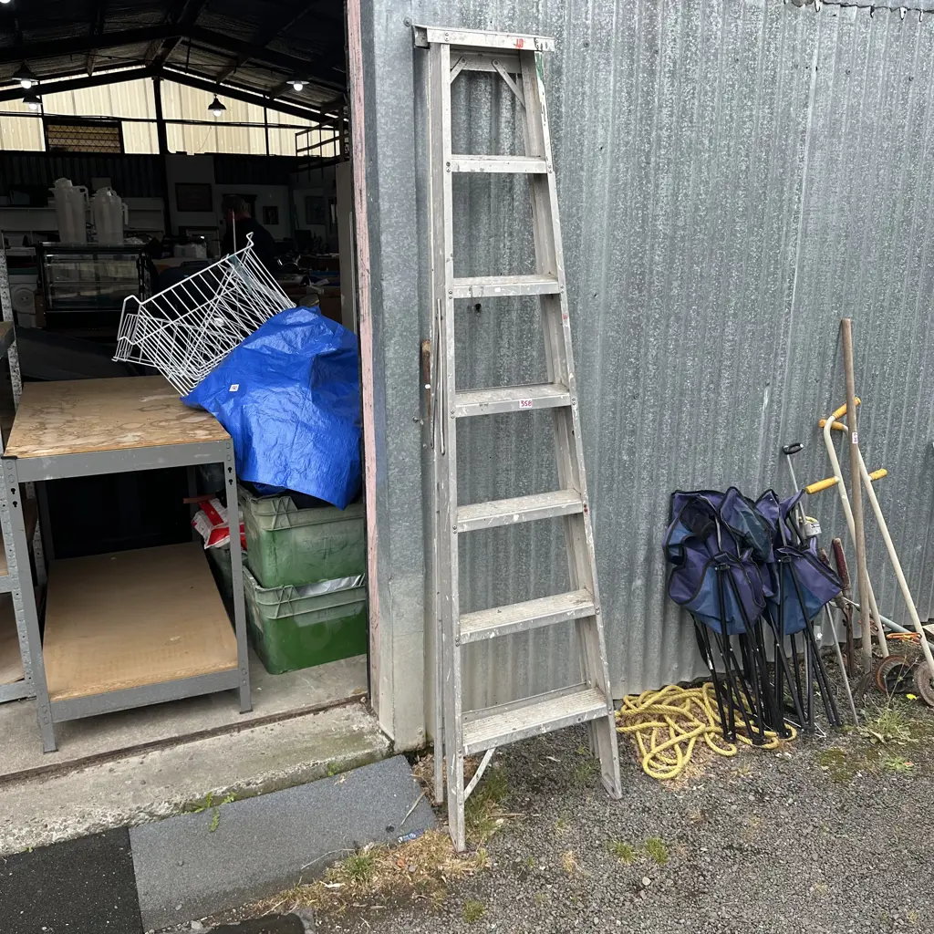 7 Foot ladder and garden hoe. Image 1++