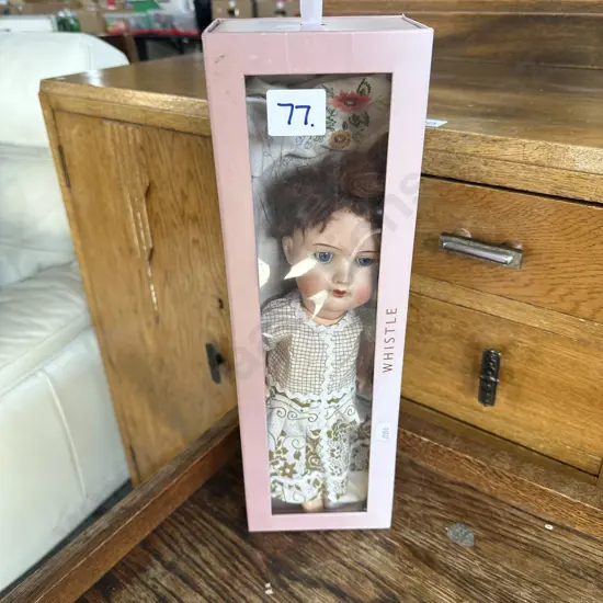 boxed whistle doll