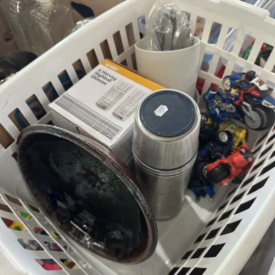 Basket of cutlery, new glasses and toy bikes etc.
