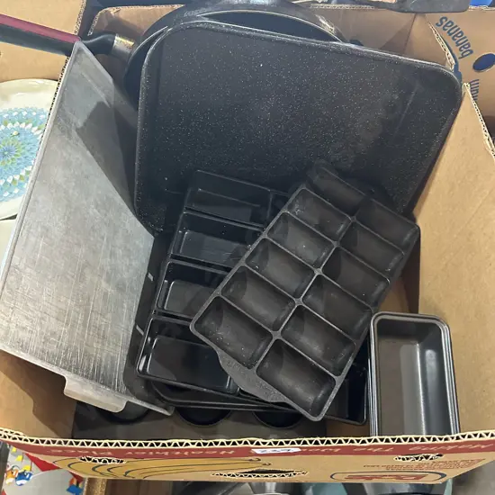 Box of non-stick baking and gem iron etc.