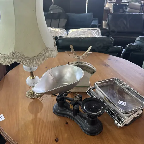 Assorted vintage scales and lamp.