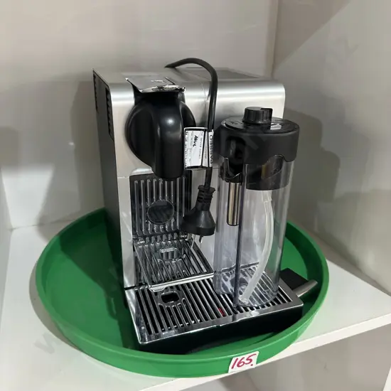 DeLonghi Nespresso coffee maker and tray.