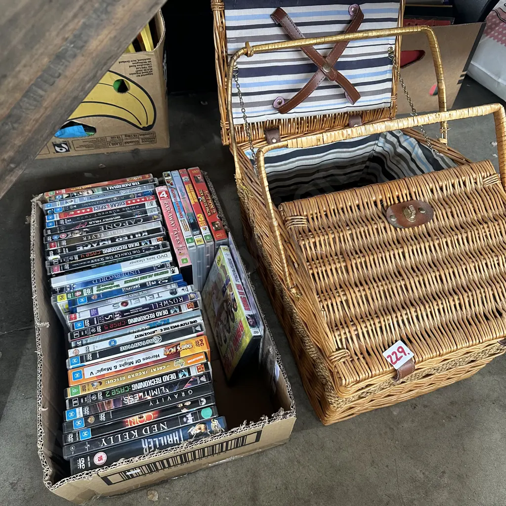 Box of DVDs and picnic basket. Image 1++