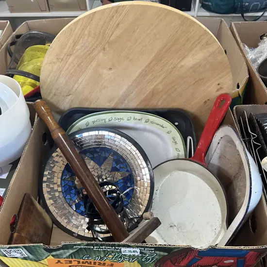 Large wooden platter, cast iron pan, enamel dish.