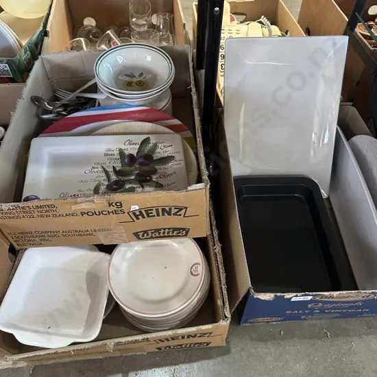 Two boxes Plates,servers and baking dishes.