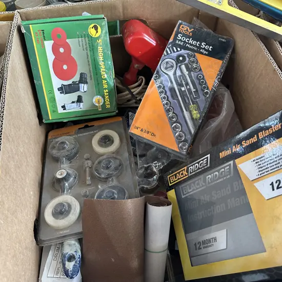 Box of tools including Air sander, Air sand blaster kit and socket set etc.