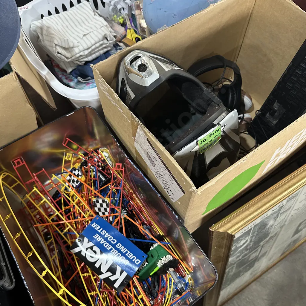 Box of headphones, keyboard, helmet and Knex. Image 1++