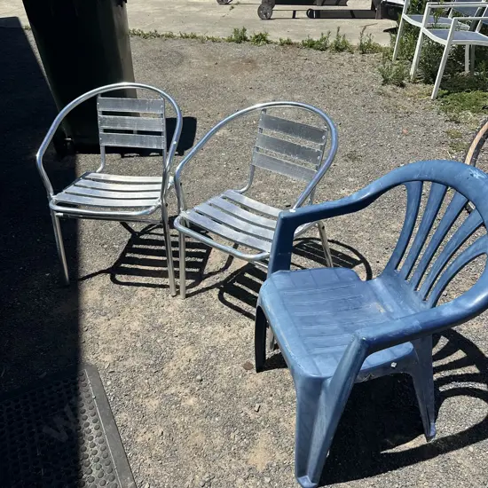 2 metal and 1 plastic chairs