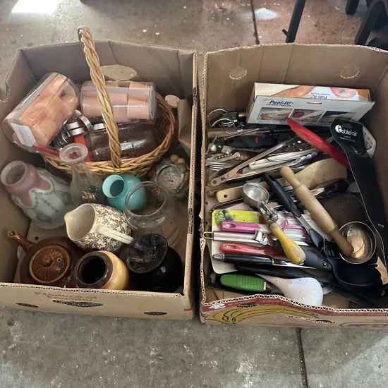 Two boxes utensils including ice cream scoop, cane basket, candles etc.