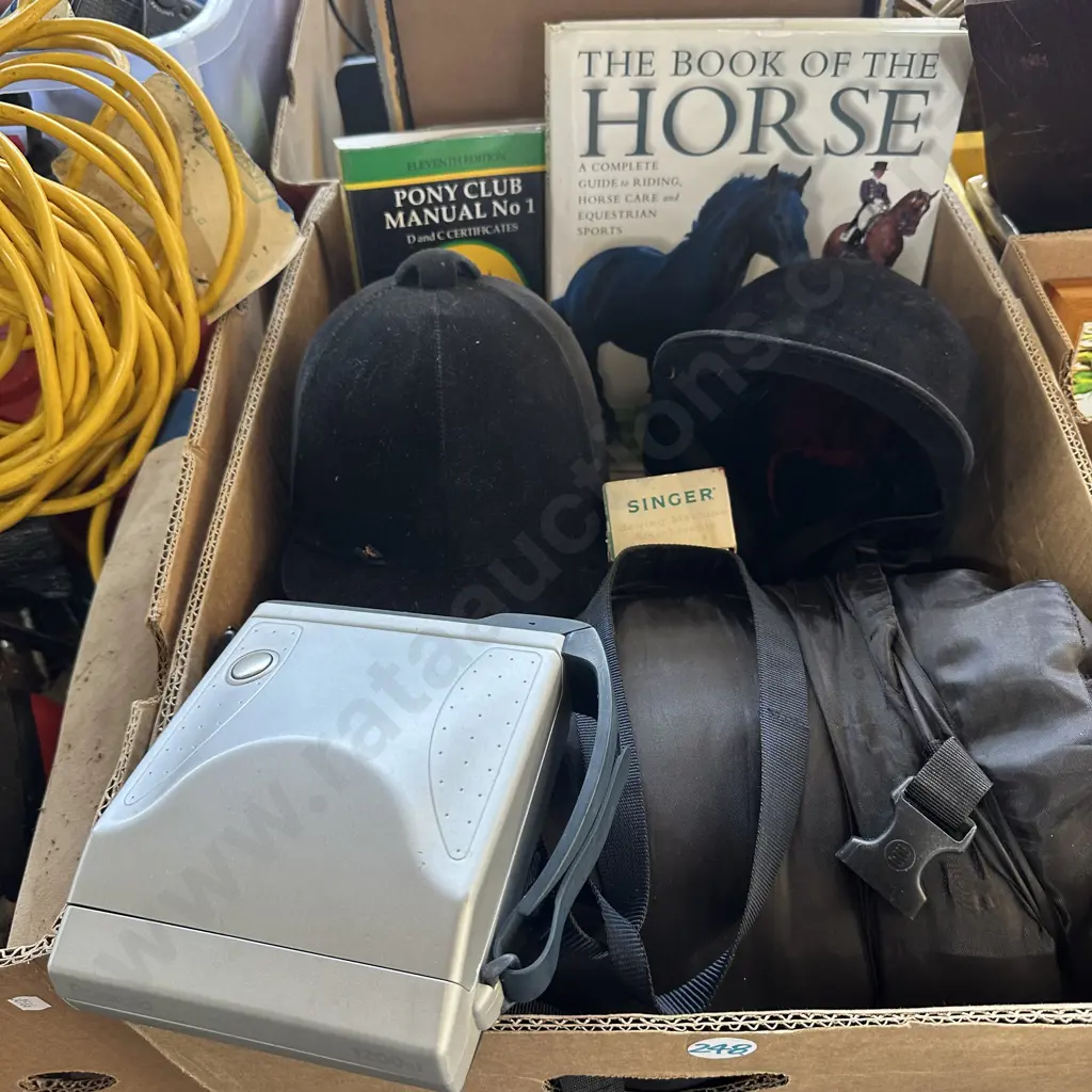 Box with sleeping bag, horse riding helmets and polaroid etc. Image 1++