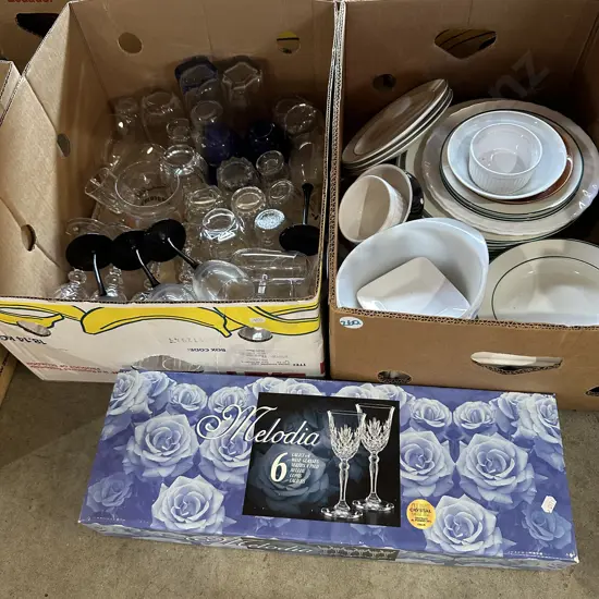 Two boxes of plates and glasses, boxed crystal glasses.