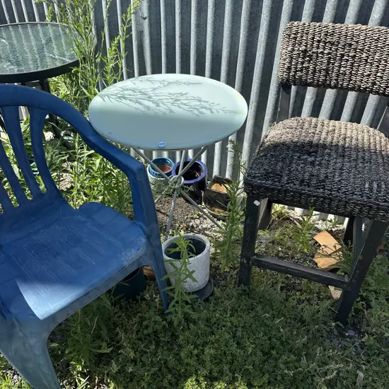side table 2 chairs and planters