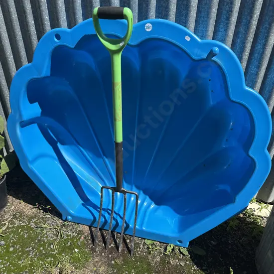 kids paddle pool and garden fork
