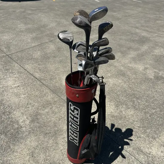 Kids golf bag plus lots of clubs