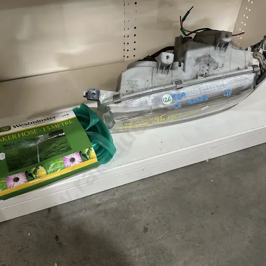 Soaker hose plus Left front headlight off a CB Accord.
