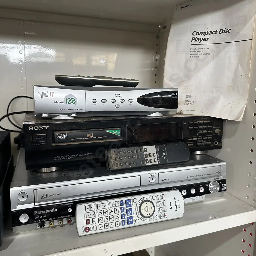 Sony CD player, Panasonic DVD/VCR combo player plus digital satellite receiver and remotes. Image 1++