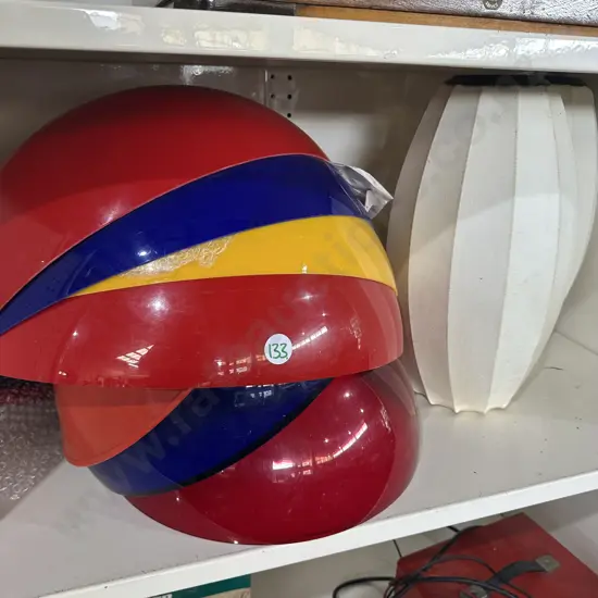 Shelf lot of retro light shades.