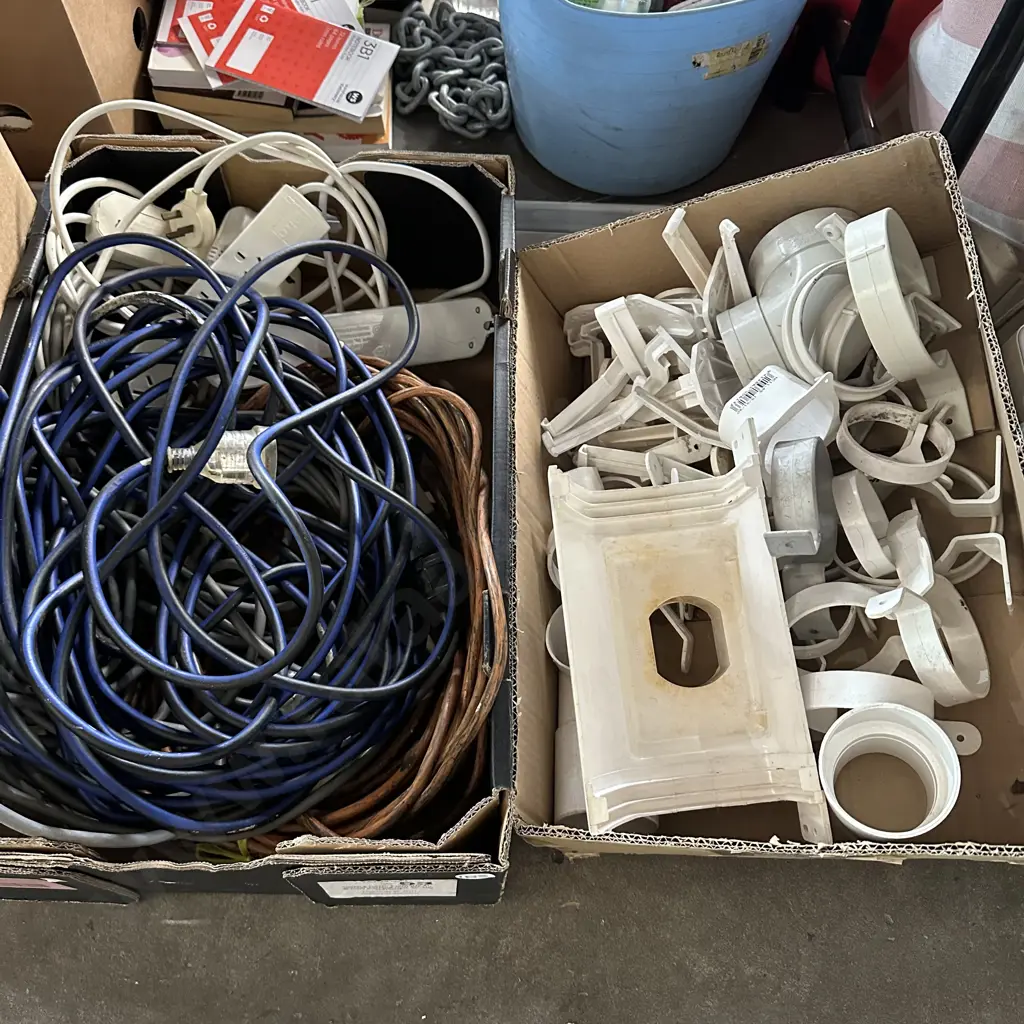 Two boxes of extension leads, spouting and downpipe brackets etc. Image 1++
