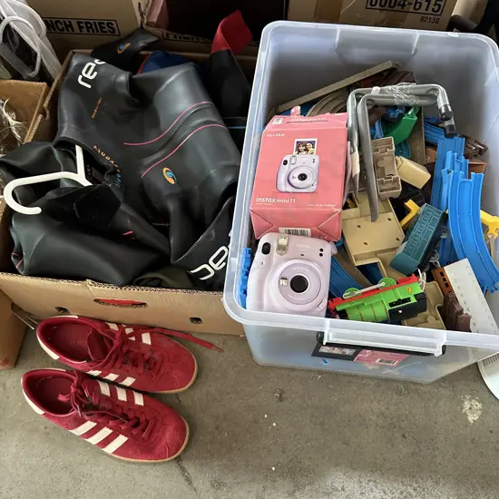 Two boxes wetsuits, shoes and toys etc.