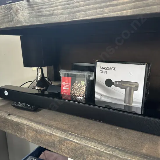 massage gun, lights, sound bar and lamp