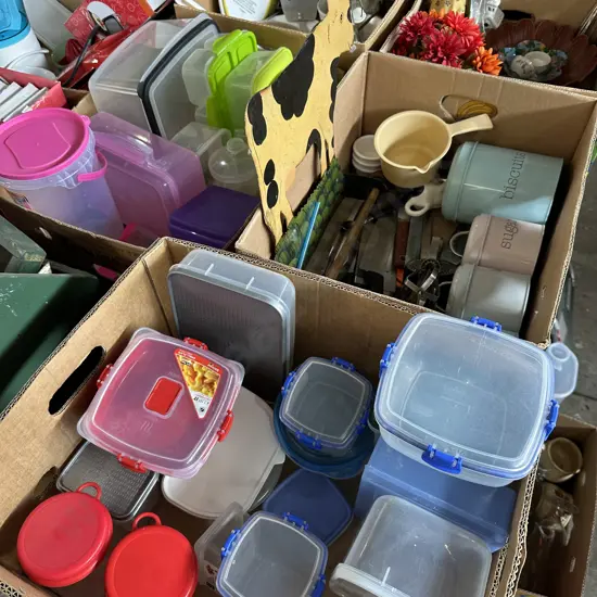 Three boxes of storage containers and canisters with Sistema, knives and egg beater etc.