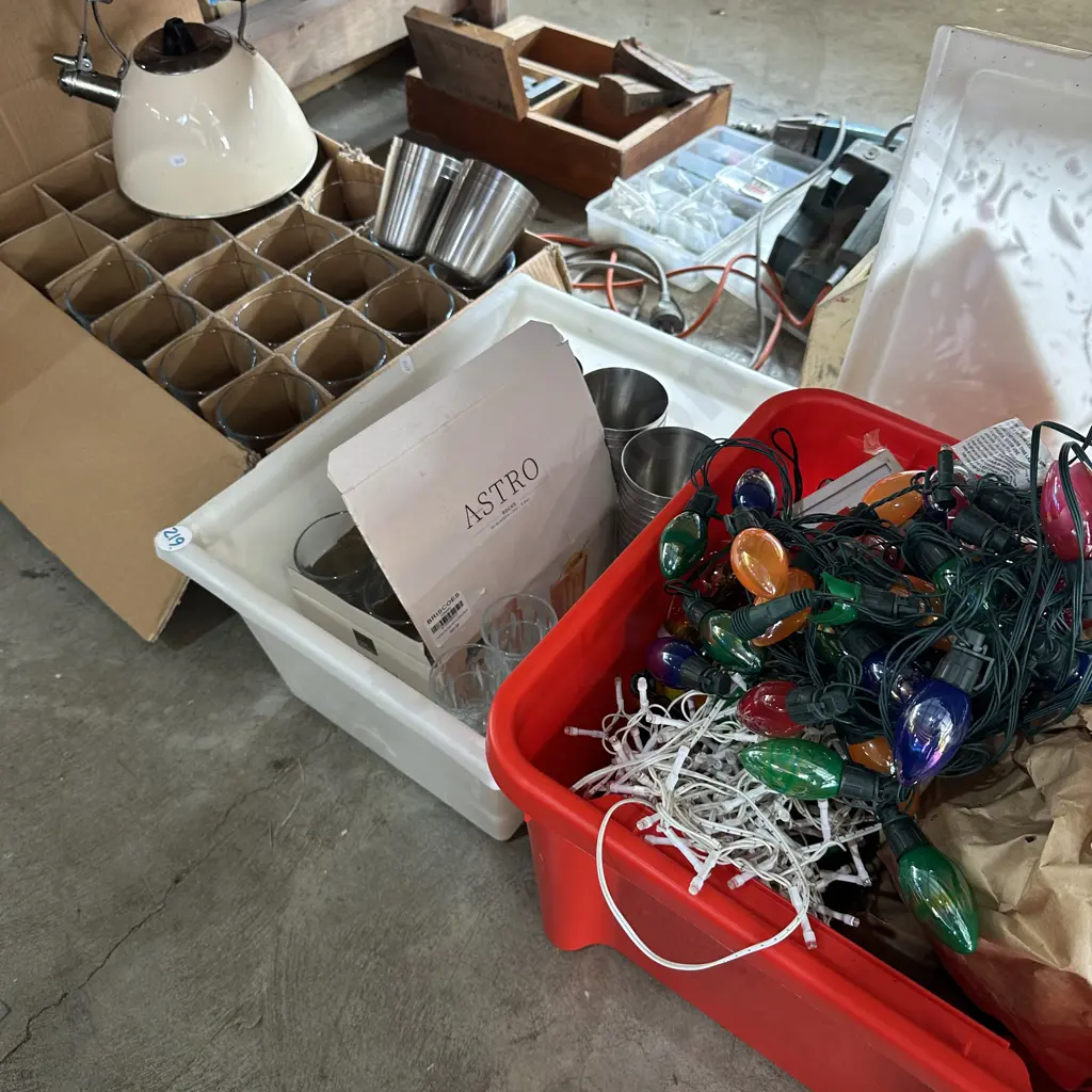 Bay lot of glasses, kettle, s/s cups, bin full of strings of lights. Image 1++