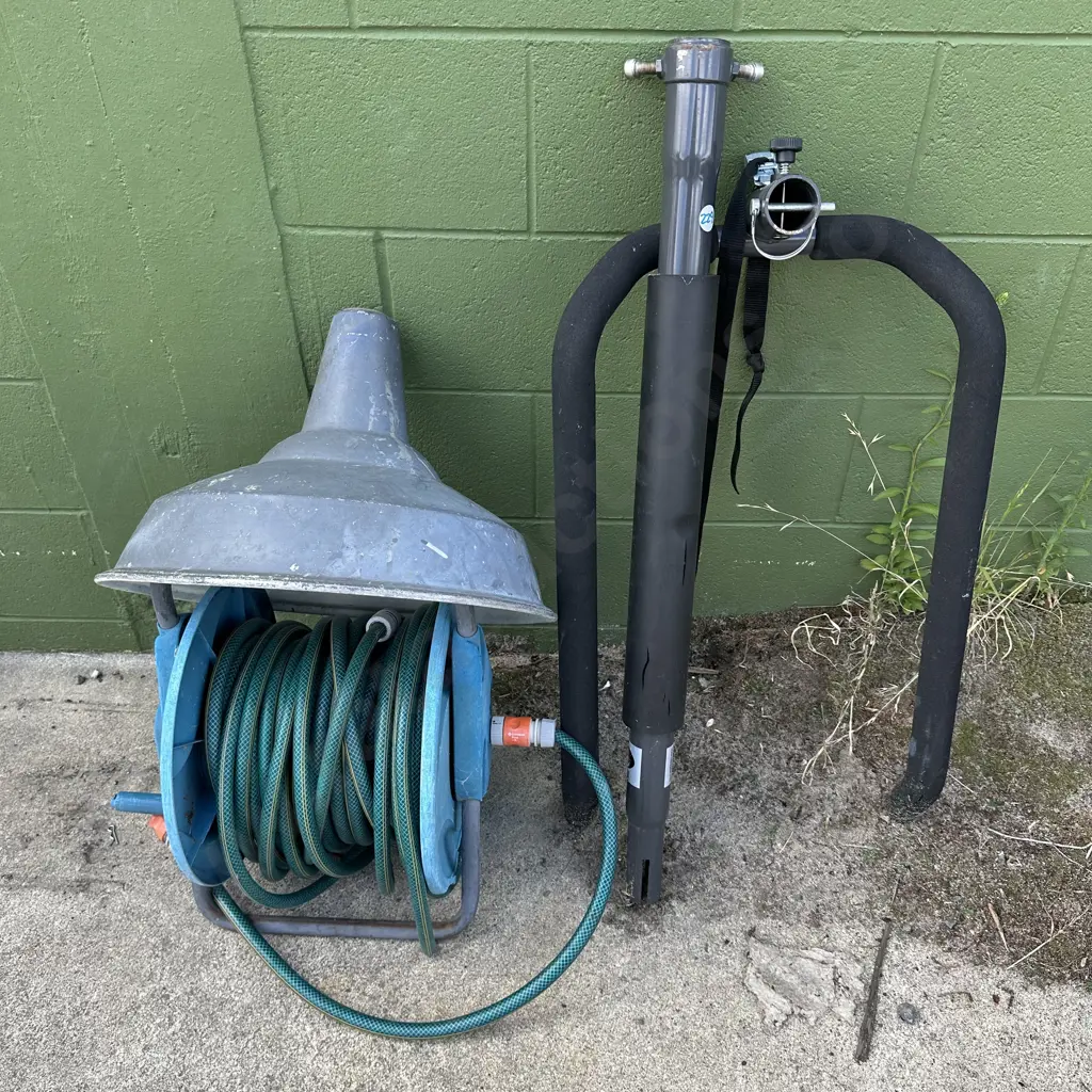 Bike rack, light shade, hose and reel. Image 1++