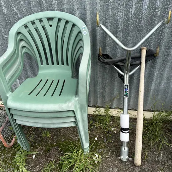 Four plastic chairs, double bike rack and bat.
