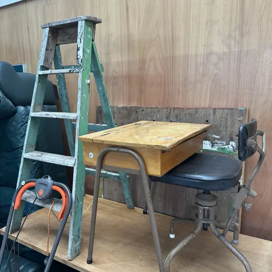 Wooden ladder, school desk and antique chair.