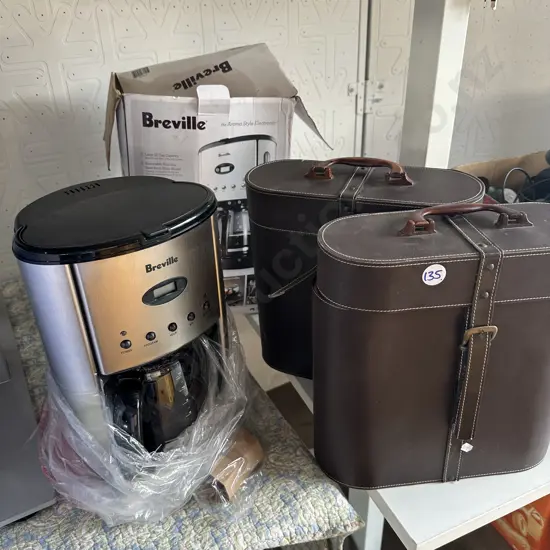 Un-used Breville coffee machine and a pair of leather cases.