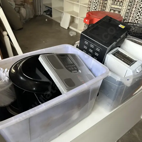 Two bins of appliance, baking and scales plus a heater.