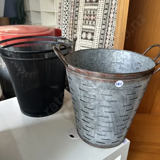 Four metal paper bins.