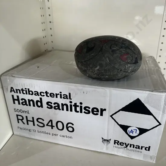 Hand sanitiser expired 07/2025 plus door stop.