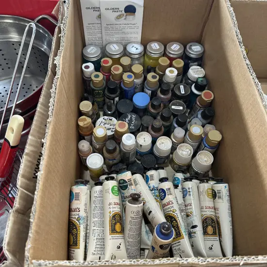Box of assorted craft paints.