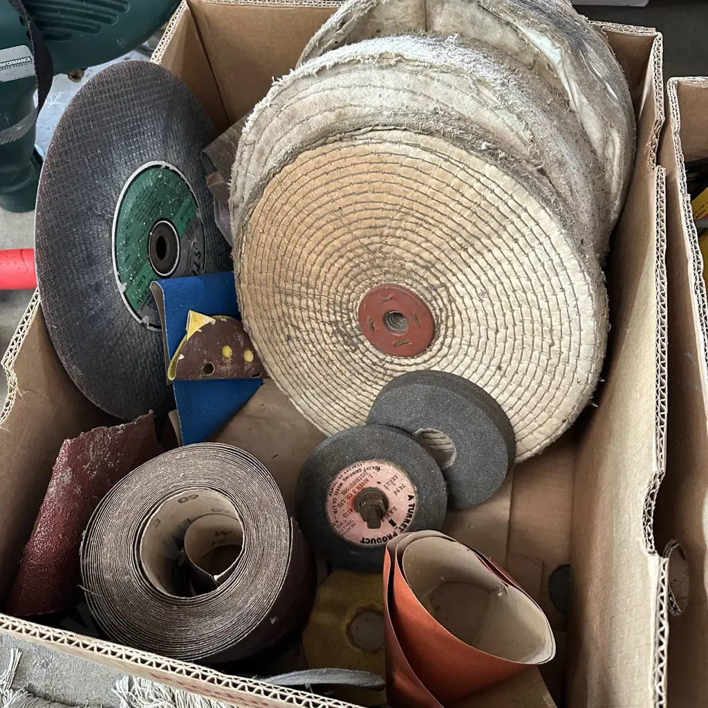 Bin of sandpaper, polishing and grinding disks etc. Image 1++