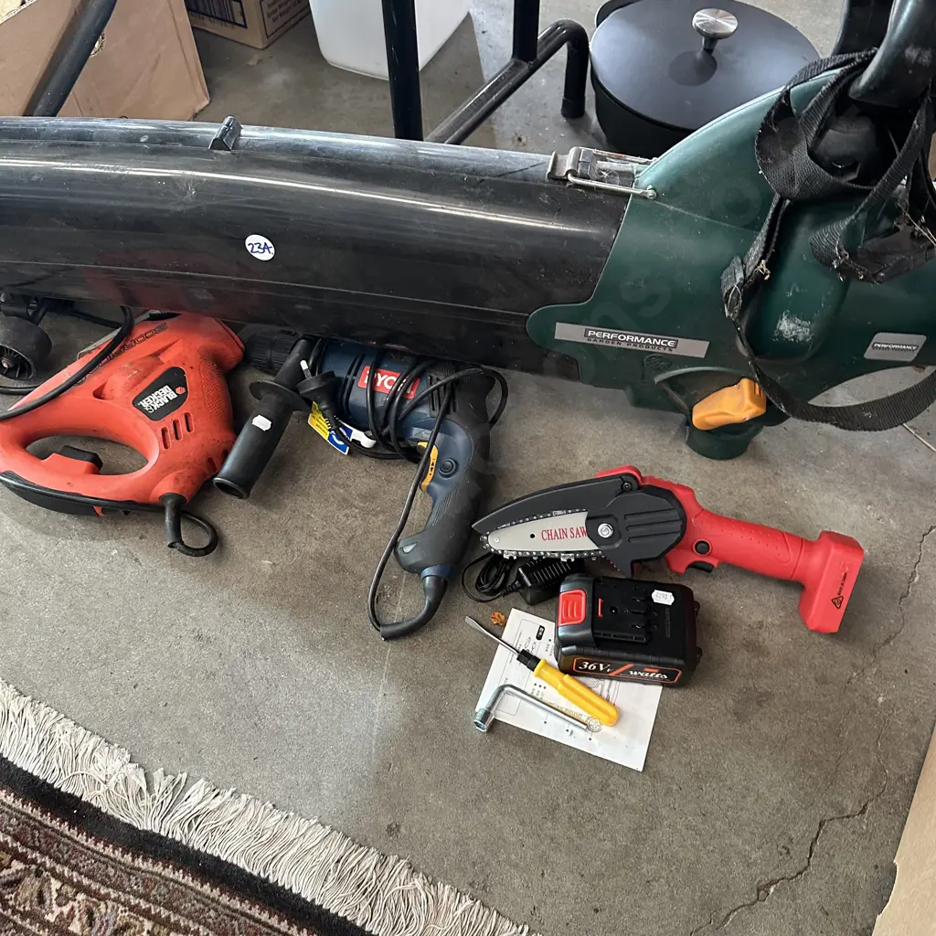 Blower/vac with no bag, power saw and drill. Battery chainsaw with fault. Image 1++