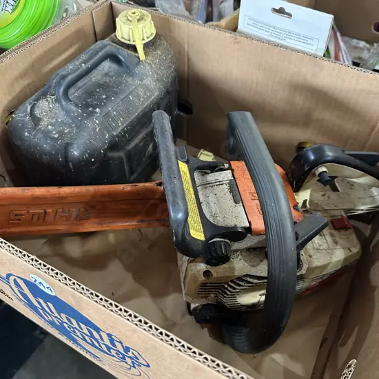 Chainsaw and fuel can - sold as working.