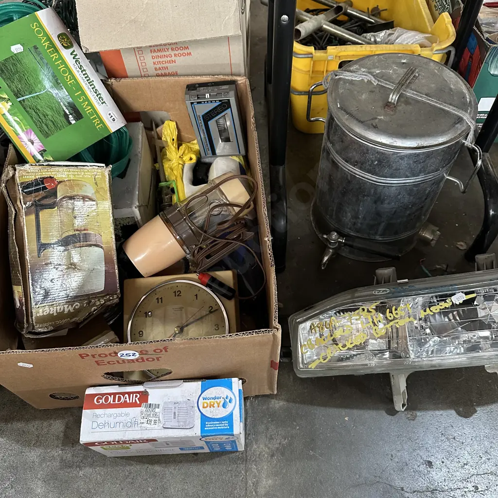 Box of assorted items including soaker hose and honda headlight etc. Image 1++