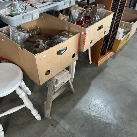 Two stools plus short saw horse, two boxes of glasses and CD stand.