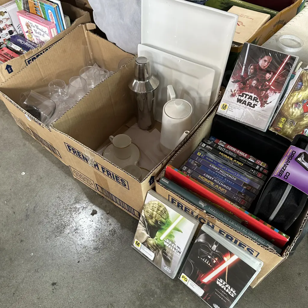Four boxes glasses, books, DVD movies including Star Wars. Etc. Image 1++